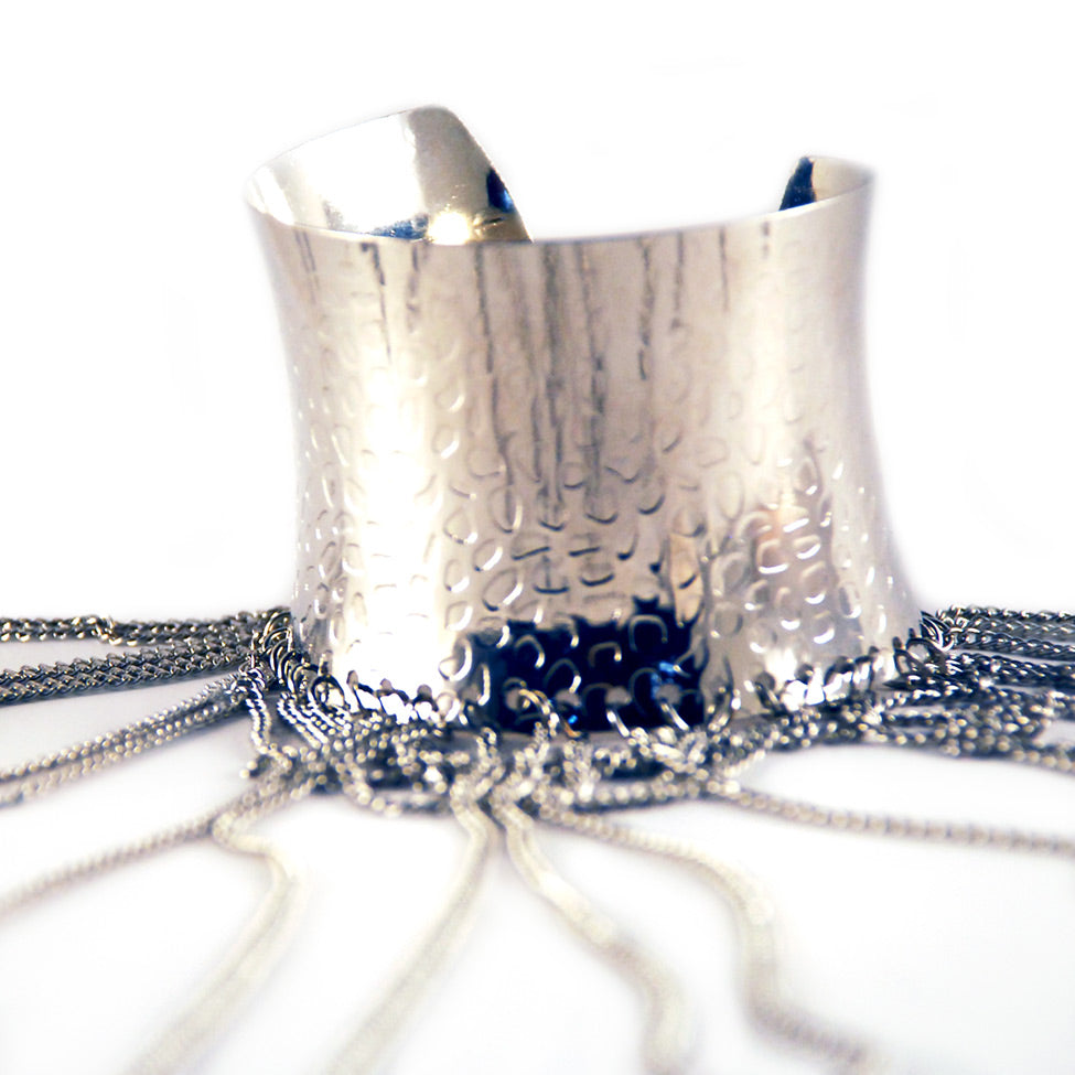 Helios: Diana Hammered Cuff w/Draped Chains. Fashion Jewelry by Nando Medina