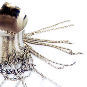 Helios: Diana Hammered Cuff w/Draped Chains. Fashion Jewelry by Nando Medina